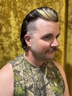 Client with fashion mullet and blonde color placement